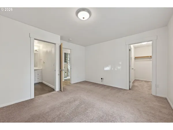 a view of hallway with wooden floor