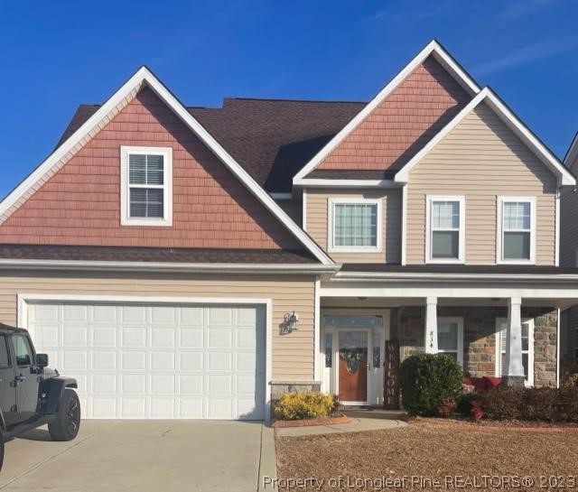 a front view of a house with garage