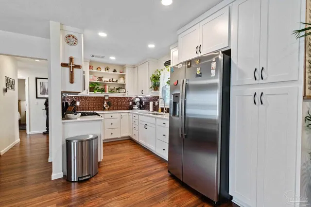 a kitchen with a stove and a microwave