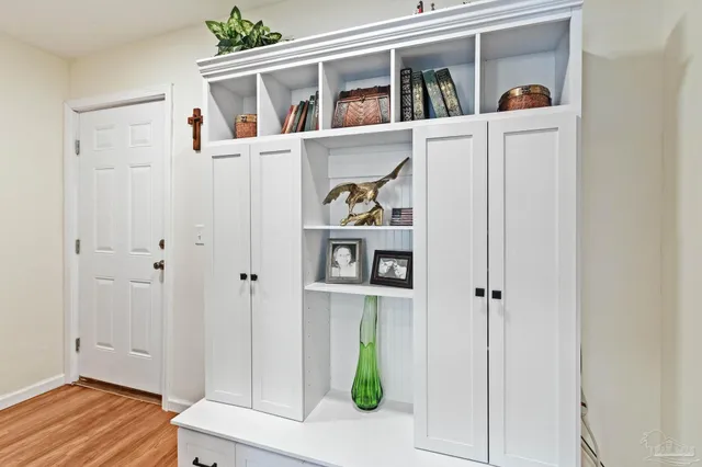 a bedroom with a bed and dresser