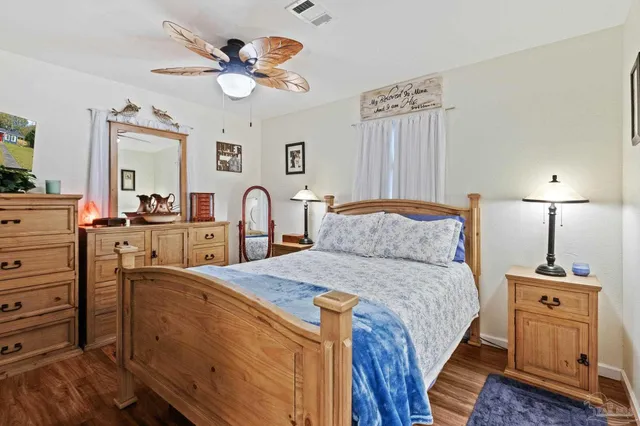 a room with cabinets a sink and a window