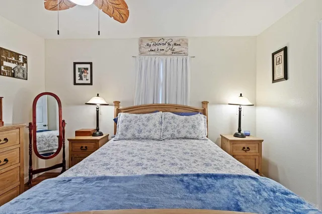 a bathroom with a granite countertop mirror and a sink