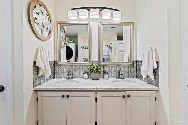 a room with a table and a chandelier