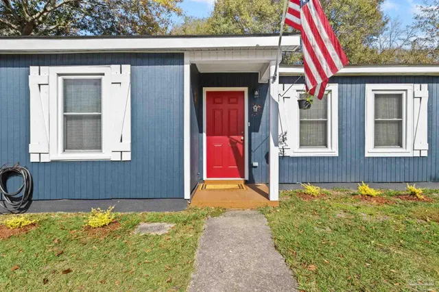 a living room with furniture wooden floor and a chandelier