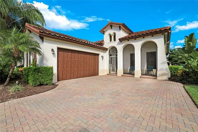 a view of a white house with a outdoor space