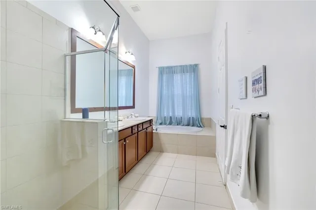 a bathroom with a bathtub and a sink