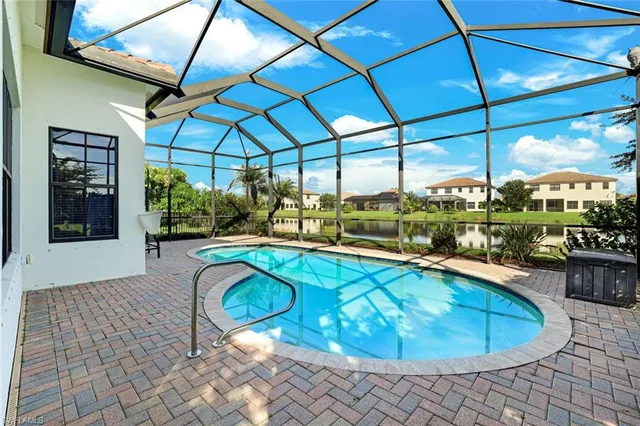 a view of a swimming pool with a porch
