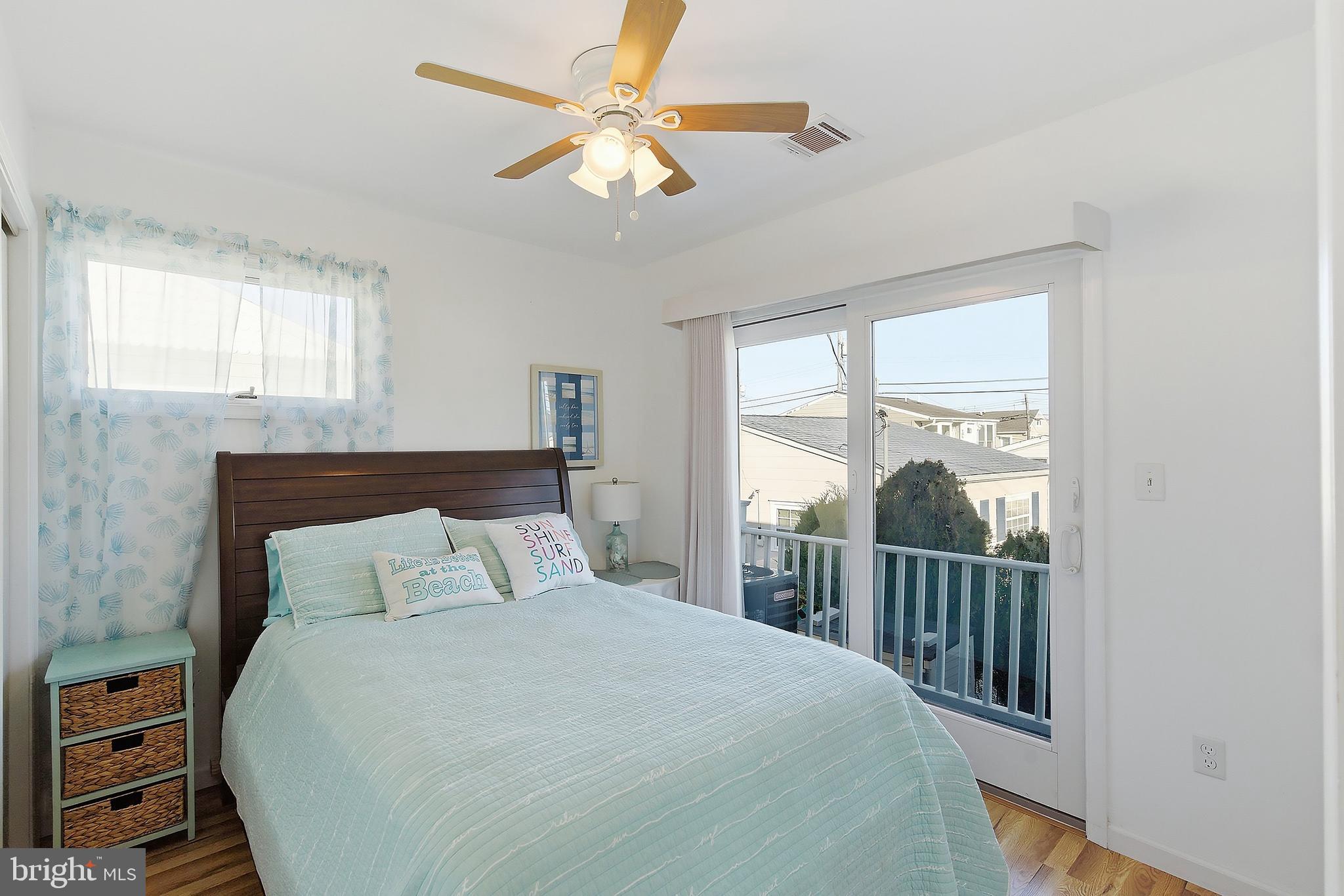 102 West Pompano Way Lavallette, NJ 08735 - Photo 11 of 28 a bedroom with a large bed and a window