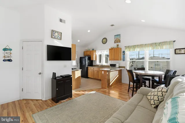 a living room with fireplace furniture and a flat screen tv