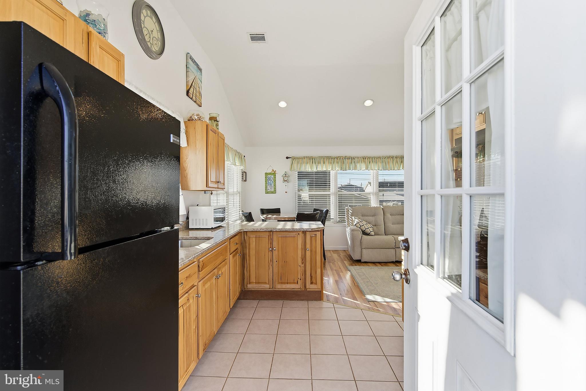 102 West Pompano Way Lavallette, NJ 08735 - Photo 5 of 28 a kitchen with stainless steel appliances granite countertop a refrigerator and a sink