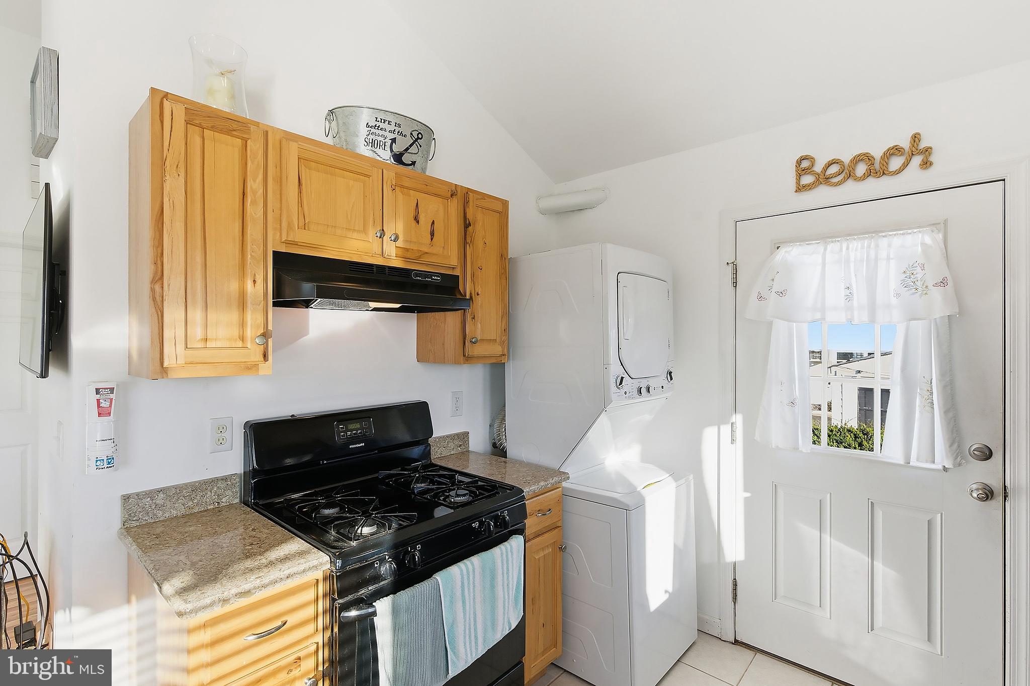 102 West Pompano Way Lavallette, NJ 08735 - Photo 7 of 28 a kitchen with stainless steel appliances granite countertop a stove and a sink