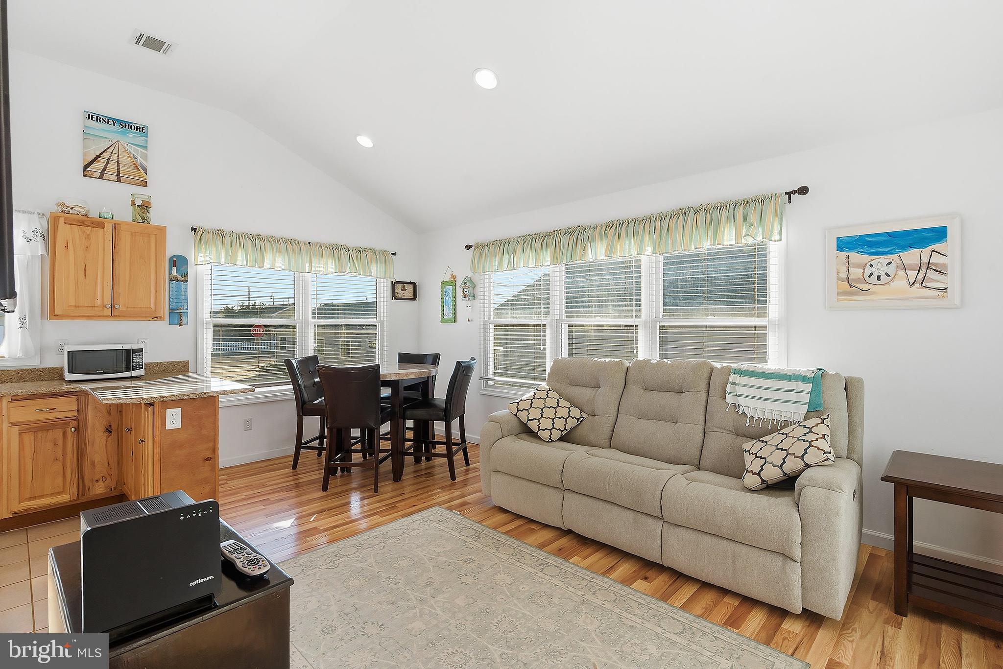 102 West Pompano Way Lavallette, NJ 08735 - Photo 9 of 28 a living room with furniture and a large window
