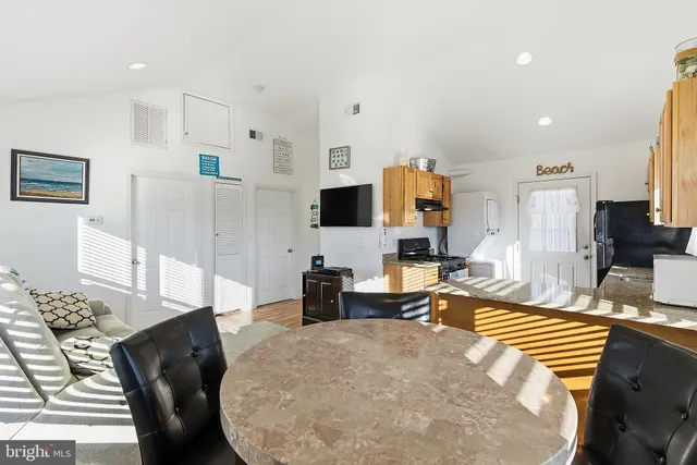 a living room with fireplace furniture and a flat screen tv