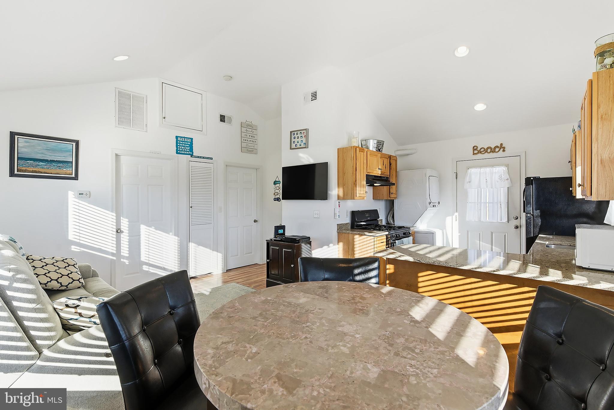 102 West Pompano Way Lavallette, NJ 08735 - Photo 10 of 28 a living room with fireplace furniture and a flat screen tv