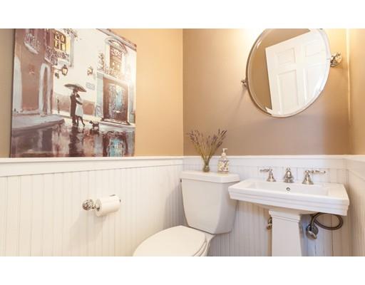 128 Revolutionary Road Concord, MA 01742 - Photo 7 of 20 a bathroom with a sink mirror and toilet