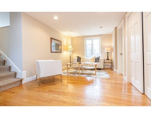 128 Revolutionary Road Concord, MA 01742 - Photo 8 of 20 a living room with couches and pool view with wooden floor