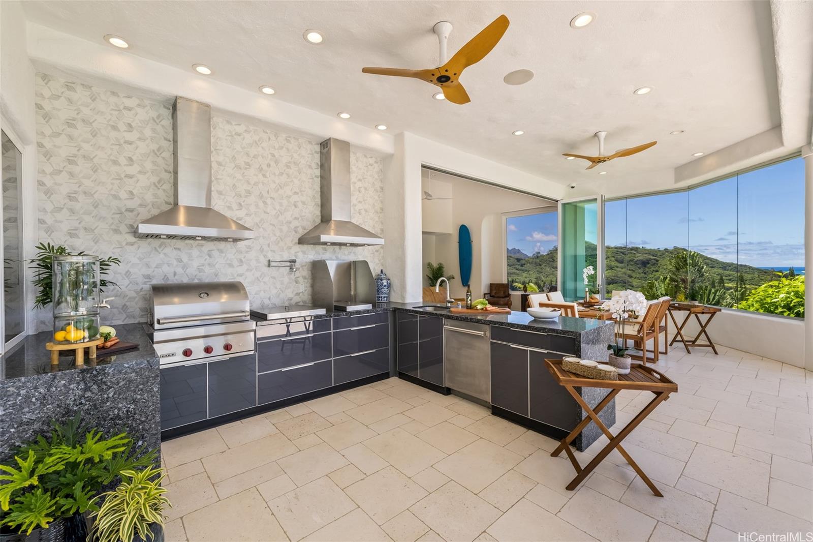 47-958 Kamakoi Road Kaneohe, HI 96744 - Photo 13 of 25 a kitchen with stainless steel appliances granite countertop a stove and a refrigerator