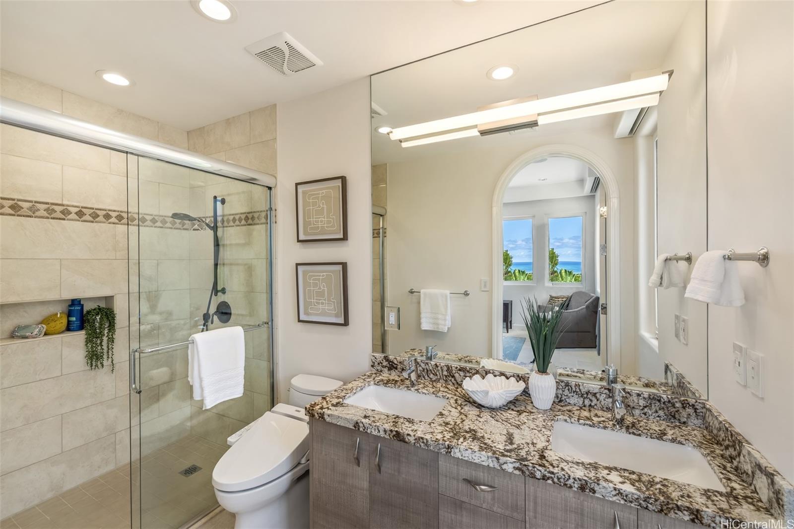 47-958 Kamakoi Road Kaneohe, HI 96744 - Photo 15 of 25 a bathroom with a granite countertop sink mirror vanity and toilet