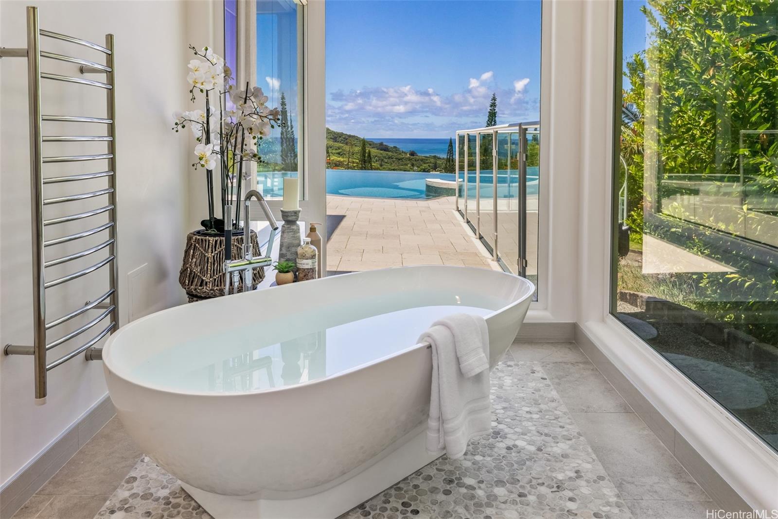 47-958 Kamakoi Road Kaneohe, HI 96744 - Photo 17 of 25 a white bath tub sitting in a bathroom next to a yard