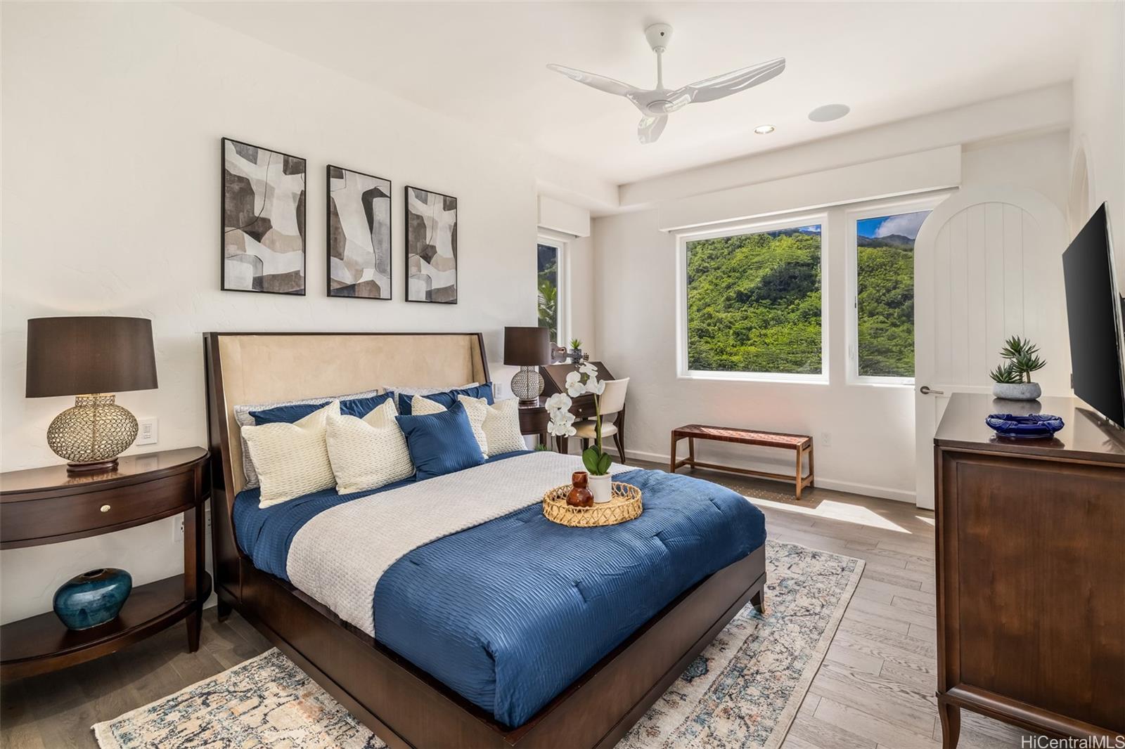 47-958 Kamakoi Road Kaneohe, HI 96744 - Photo 19 of 25 a bedroom with a bed a dresser and next to a window