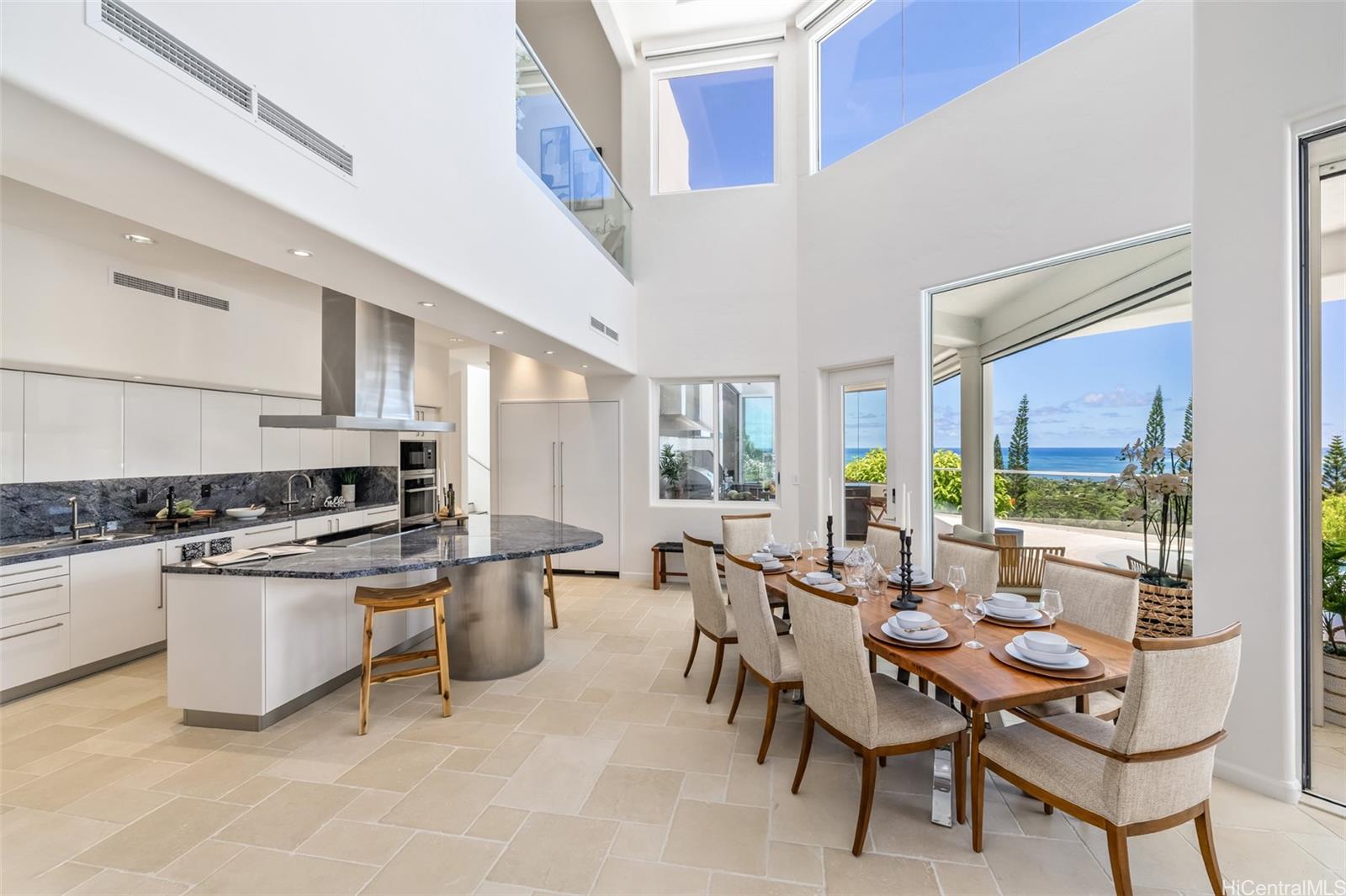 47-958 Kamakoi Road Kaneohe, HI 96744 - Photo 9 of 25 a kitchen with sink a stove and chairs