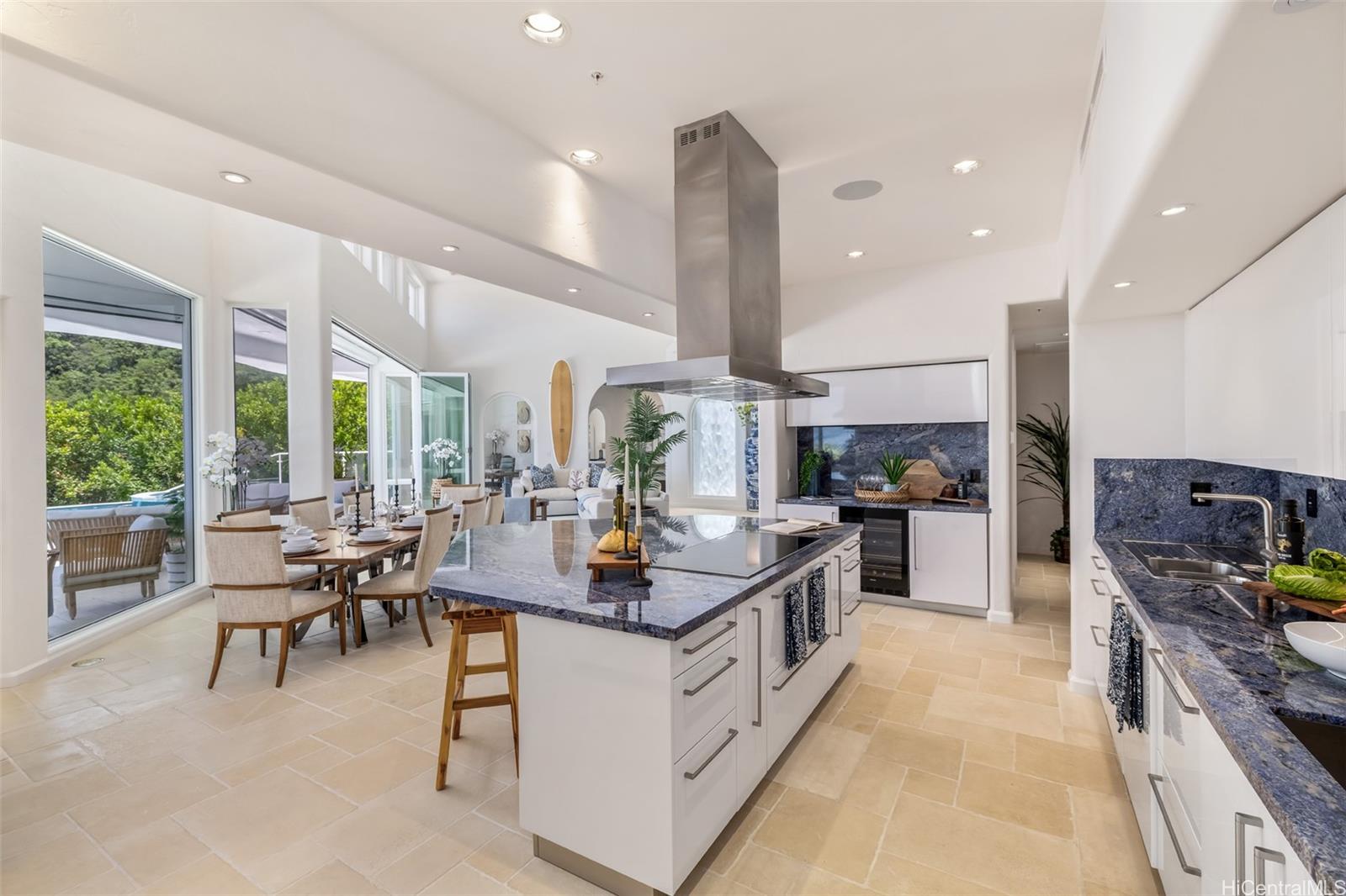 47-958 Kamakoi Road Kaneohe, HI 96744 - Photo 10 of 25 a kitchen with stainless steel appliances kitchen island granite countertop a stove and a view of living room