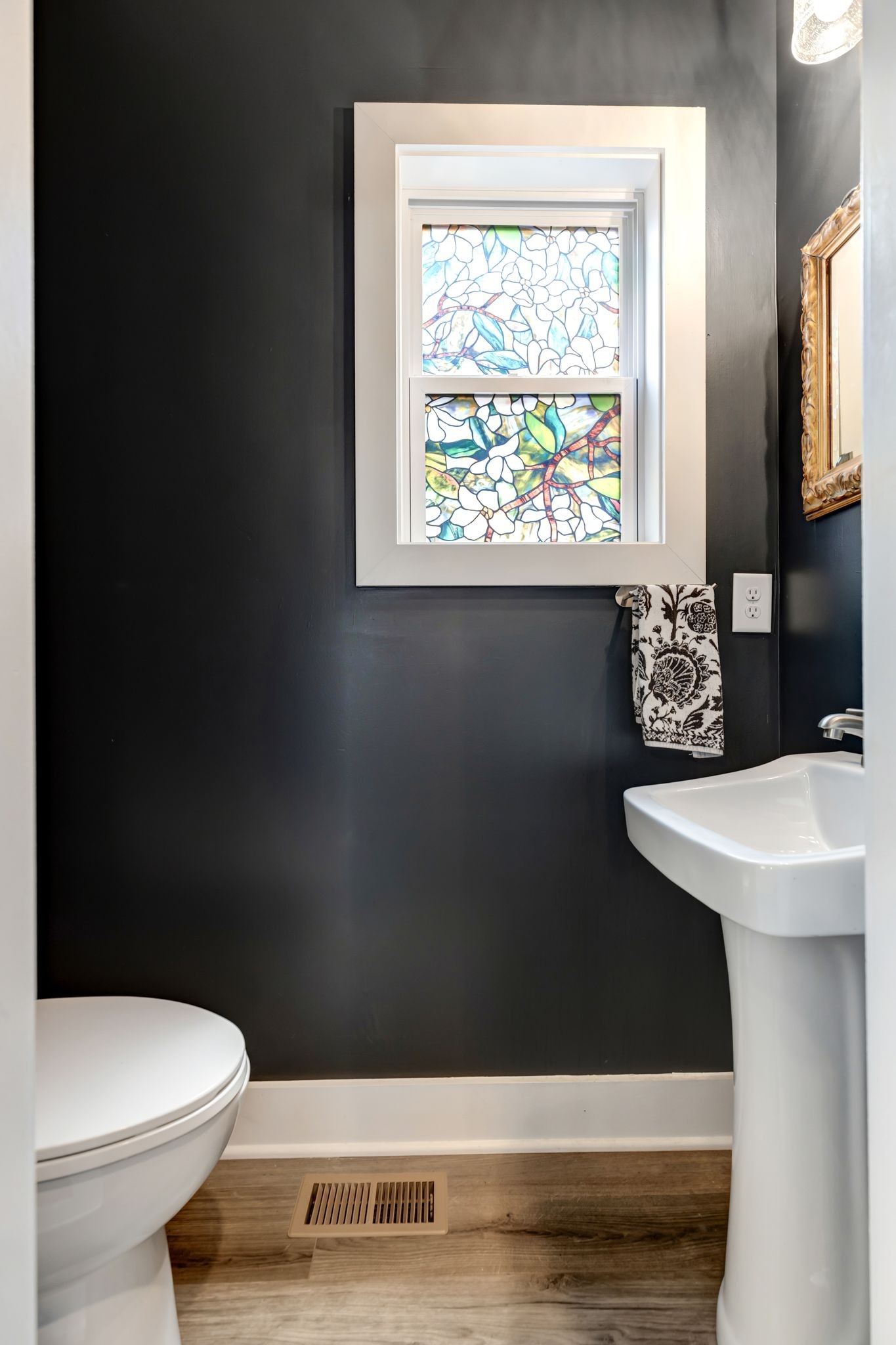 9 Decatur Street Nashville, TN 37210 - Photo 13 of 31 a bathroom with a sink a toilet and a window