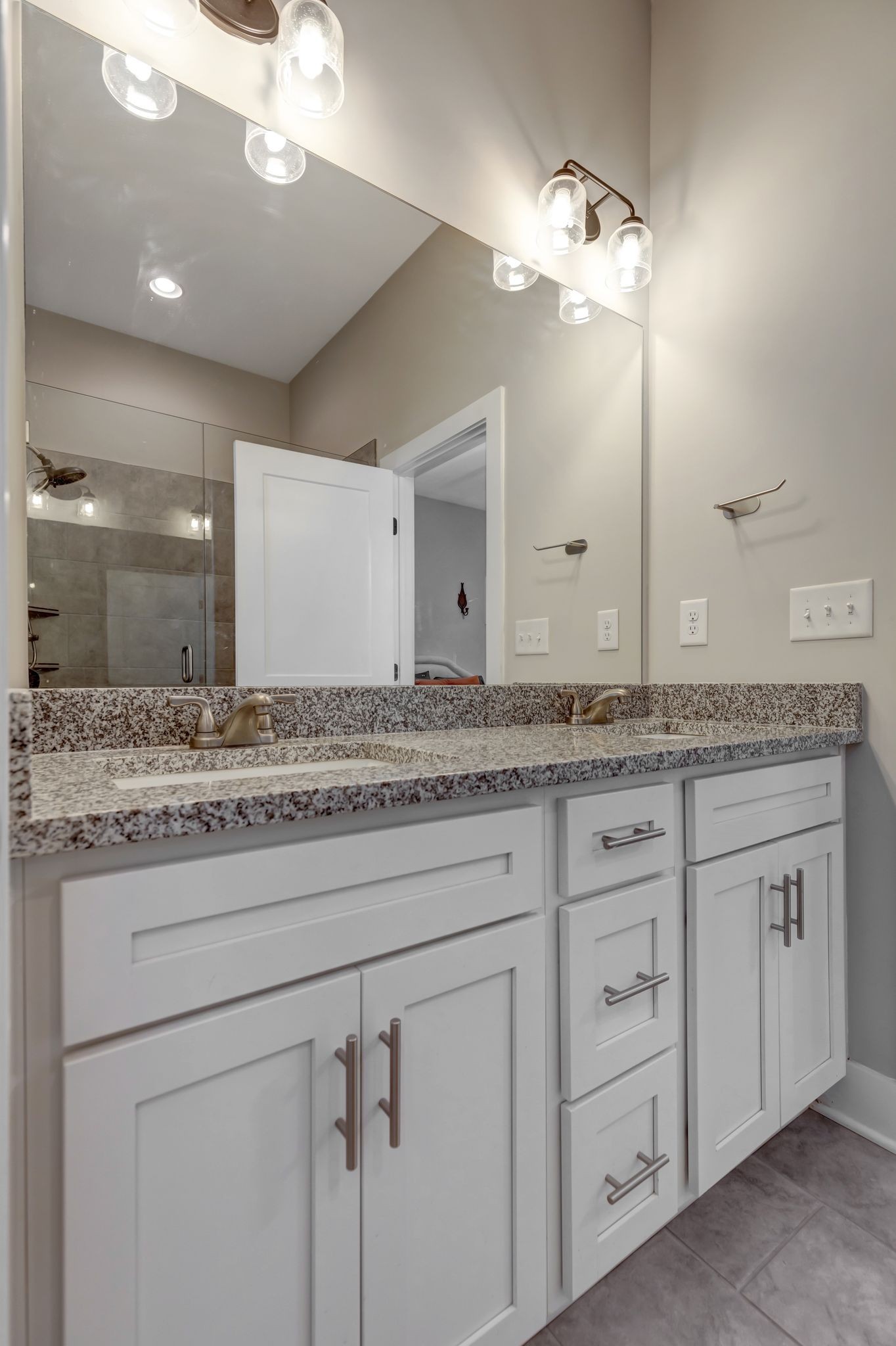 9 Decatur Street Nashville, TN 37210 - Photo 18 of 31 a bathroom with a granite countertop double vanity sink and a mirror