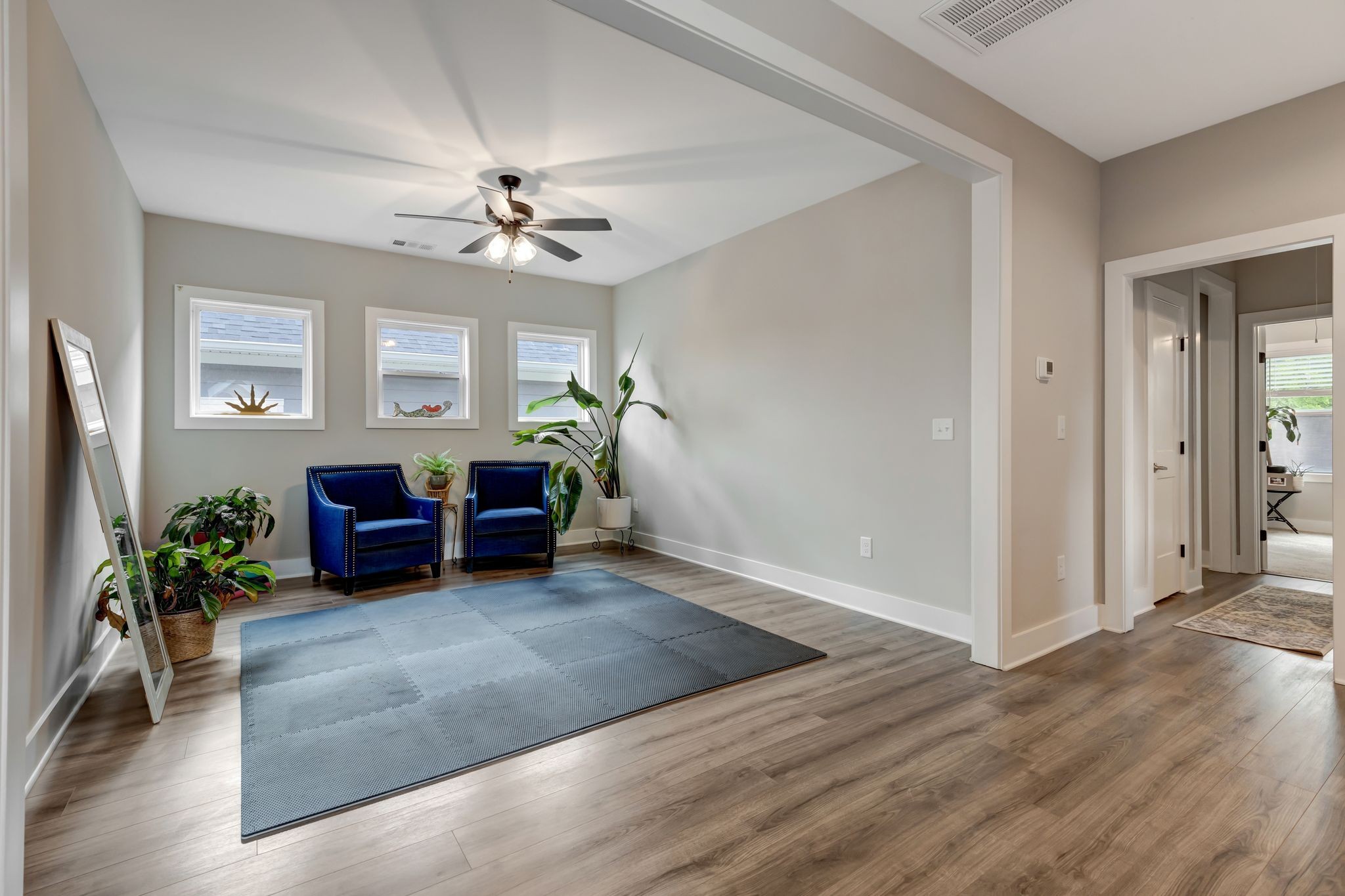 9 Decatur Street Nashville, TN 37210 - Photo 20 of 31 a living room with furniture and a chandelier