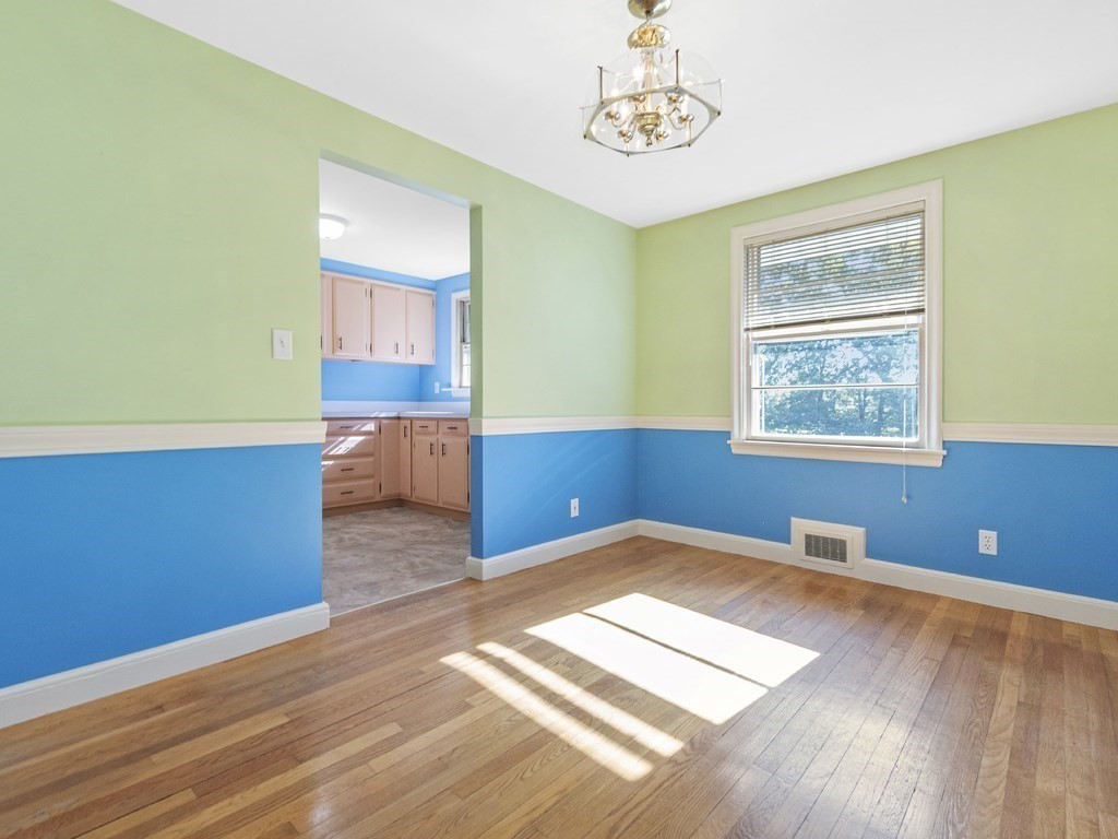 105 Hamilton Road Waltham, MA 02453 - Photo 15 of 42 a view of a room with wooden floor and window