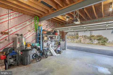 a view of a house with a yard and garage