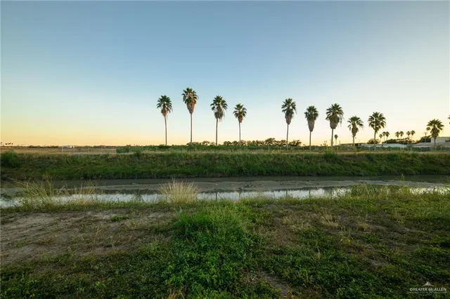 a view of a lake with a building in the background