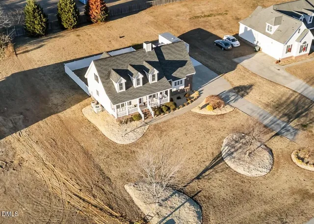 a front view of a house with basket ball court