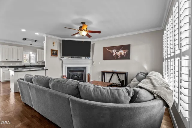 a living room with furniture fireplace and a flat screen tv