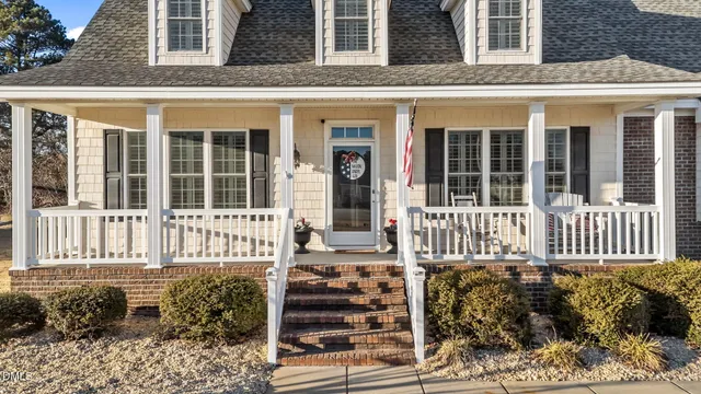 a living room with furniture fireplace and a flat screen tv
