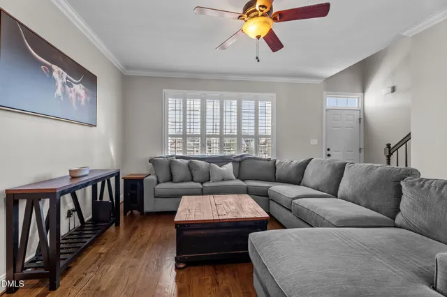 a living room with furniture fireplace and flat screen tv