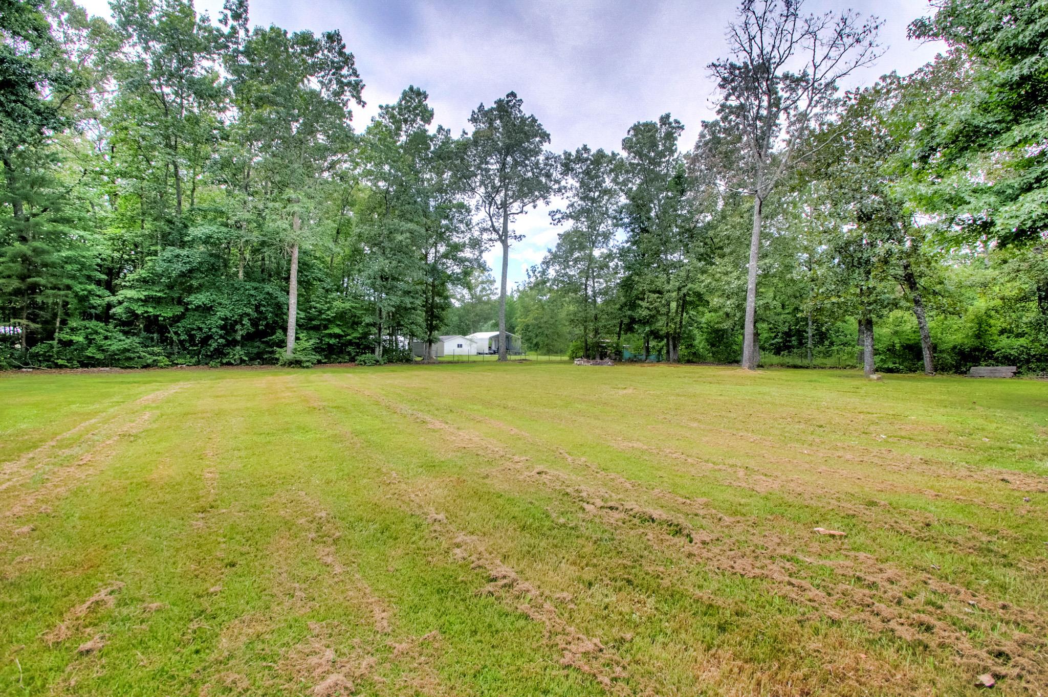 230 Lloyd Boynton Road Manchester, TN 37355 - Photo 20 of 21 Backyard (large 1.01 acre lot)