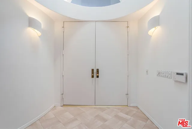 a view of a bathroom with a sink and mirror