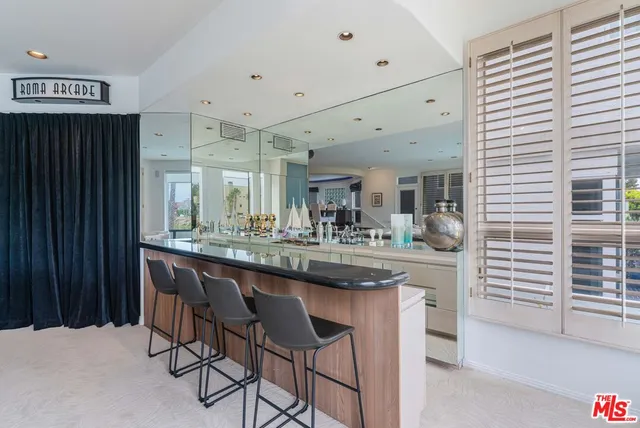 a very nice looking open kitchen with a large window