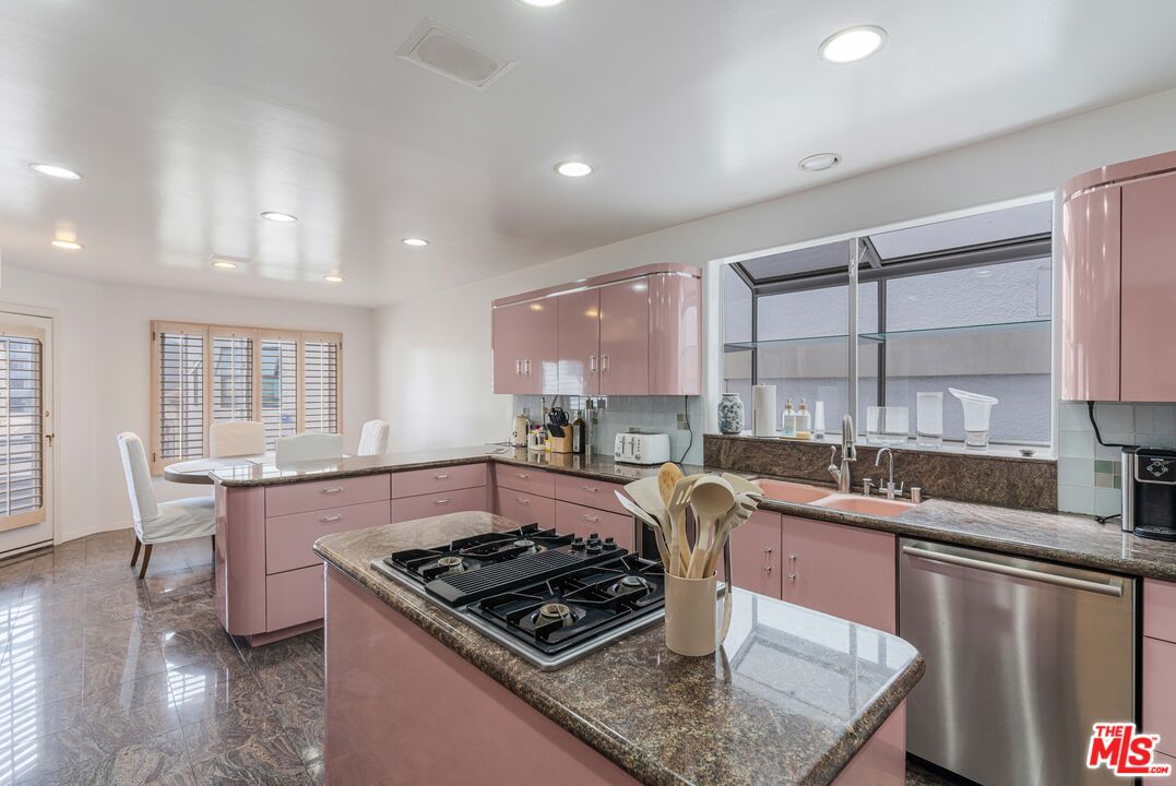 4611 Roma Court Marina del Rey, CA 90292 - Photo 21 of 46 a kitchen with stainless steel appliances granite countertop a stove a sink dishwasher and cabinets with wooden floor