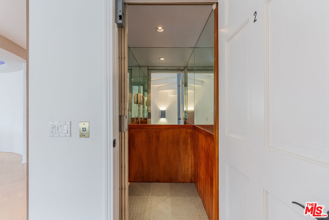 4611 Roma Court Marina del Rey, CA 90292 - Photo 28 of 46 a view of a hallway with wooden floor and a bathroom