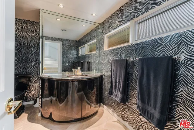 a spacious bedroom with a bed and a couch