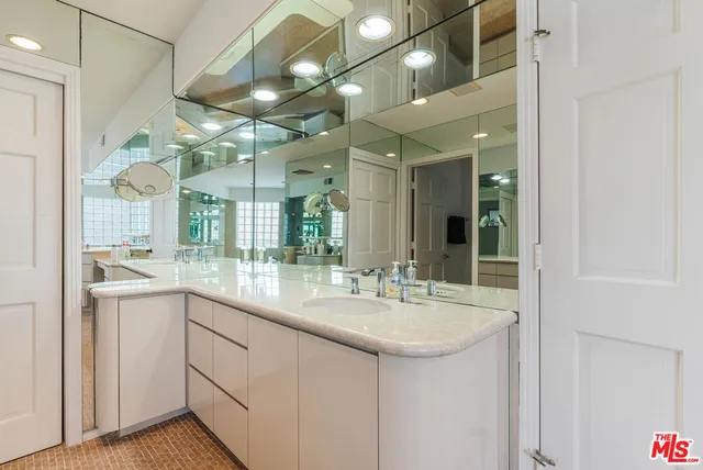 a bedroom with a bed dresser and a window