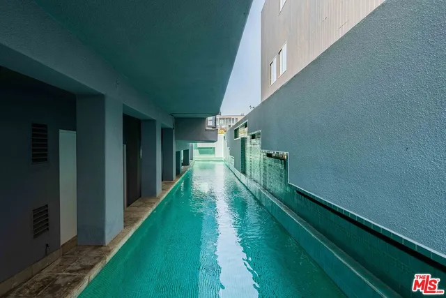 a view of a lake with couches and city view