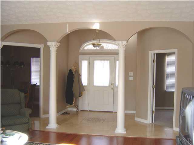 2513 Rosedown Drive Cantonment, FL 32533 - Photo 3 of 13 Foyer - limestone floors with marble mosaic centerpiece, arched column wall.