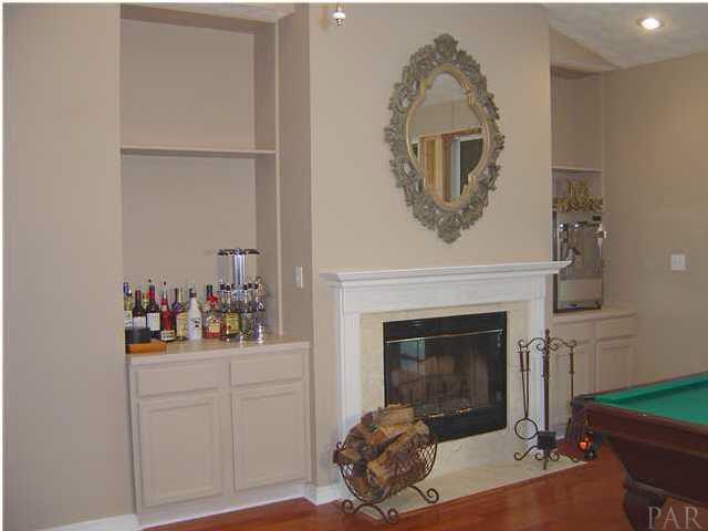 2513 Rosedown Drive Cantonment, FL 32533 - Photo 5 of 13 Greatroom - hardwood floors, fireplace, built-ins, cathedral ceiling, space for billard table.