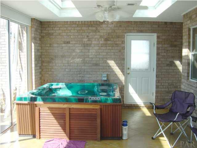 2513 Rosedown Drive Cantonment, FL 32533 - Photo 8 of 13 Sunroom - 7 person hot tub, skylights, slider to patio. Room is heated and cooled.