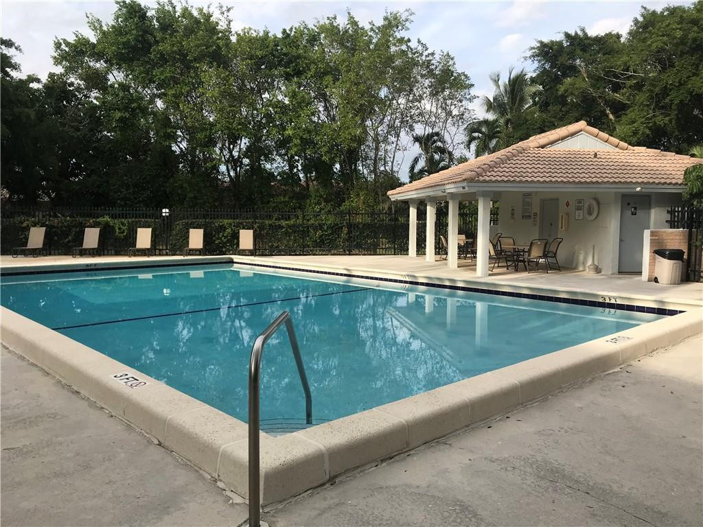 9781 Riverside Drive, Unit 653 Coral Springs, FL 33071 - Photo 19 of 19 a view of a house with pool