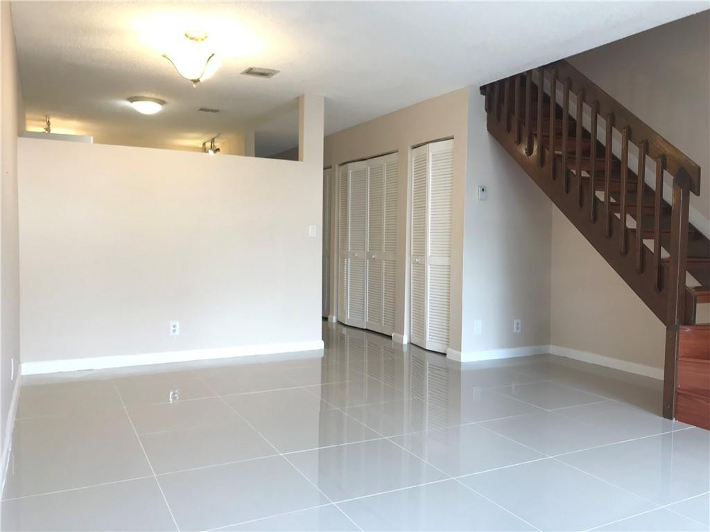 9781 Riverside Drive, Unit 653 Coral Springs, FL 33071 - Photo 3 of 19 a view of an entryway with stairs