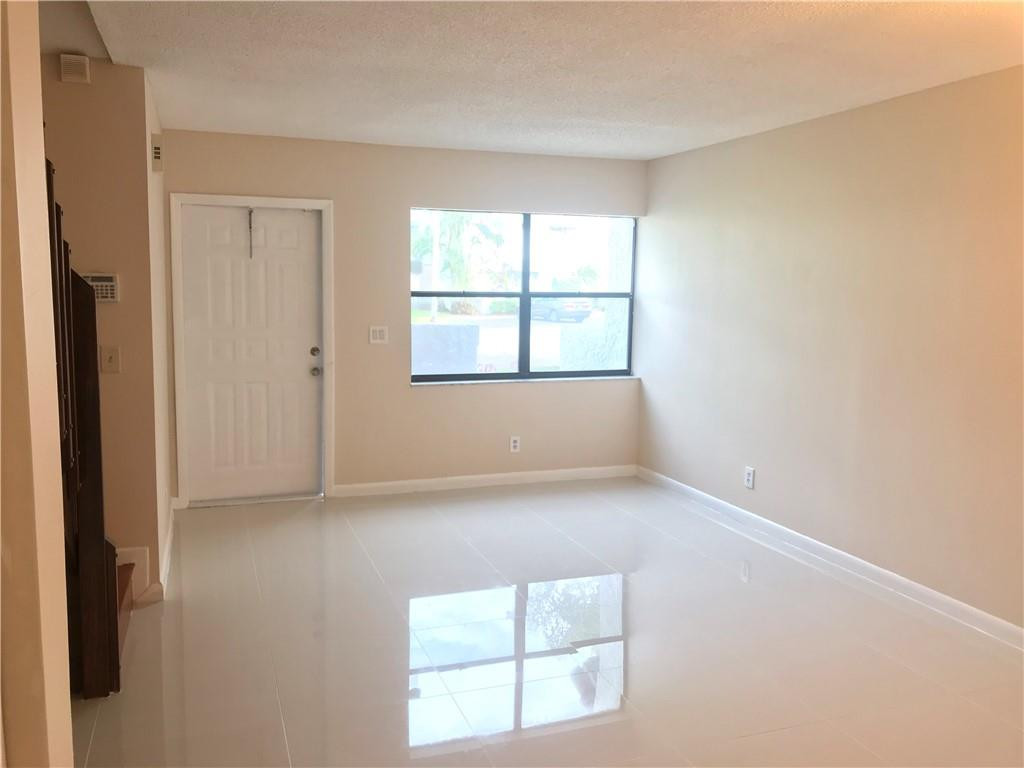 9781 Riverside Drive, Unit 653 Coral Springs, FL 33071 - Photo 5 of 19 an empty room with a window